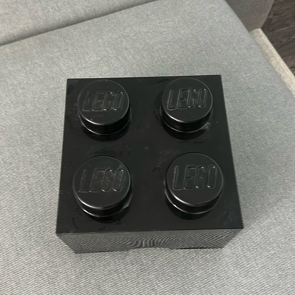 Black Lego box and pieces